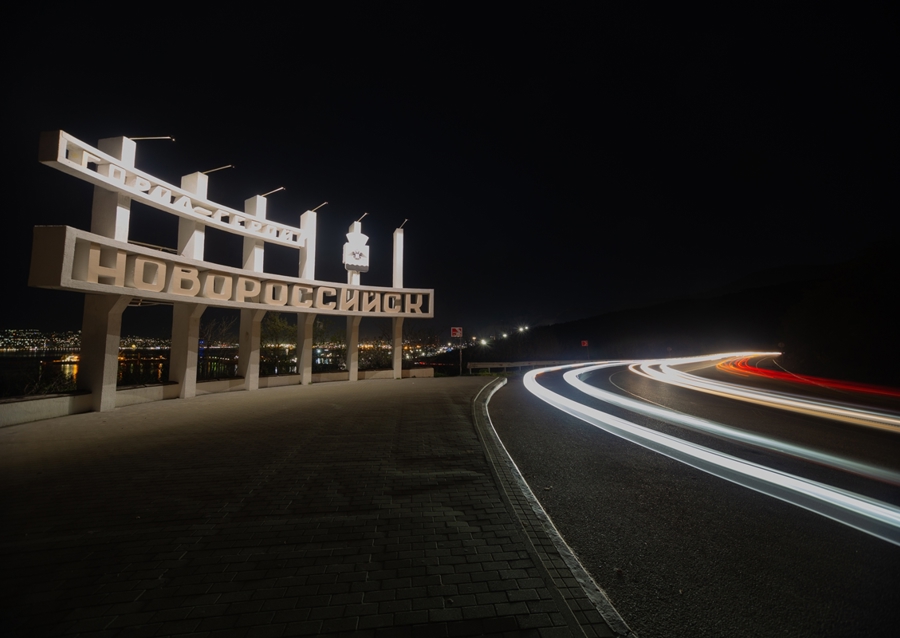 Car lights on the sea and high