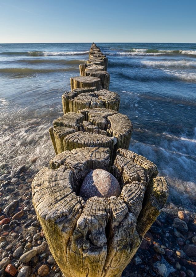 Groyne with waves in the sea