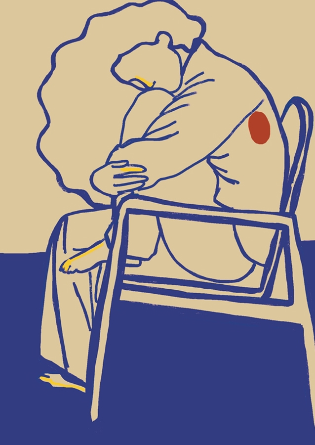 Žena sedící držící nohu